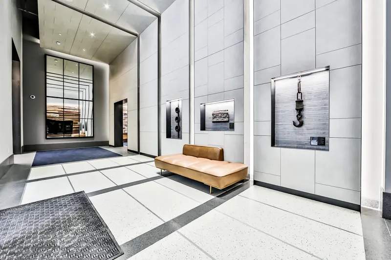 Sienna lobby seating beside illuminated art displays