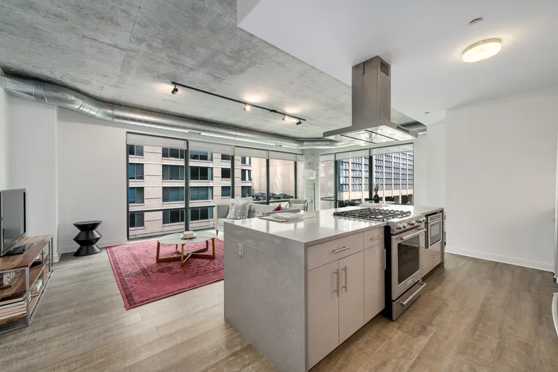 Sienna residence kitchen with a waterfall island and stainless steel appliances