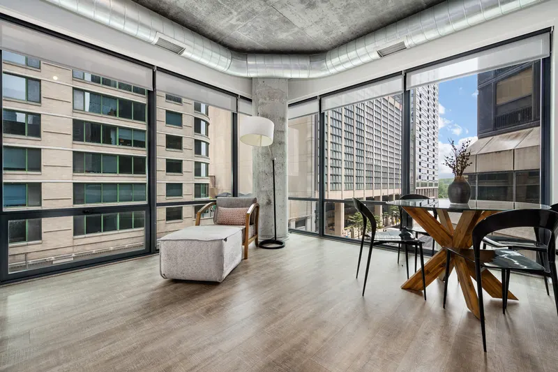 Windowed dining area and lounge in a Sienna residence
